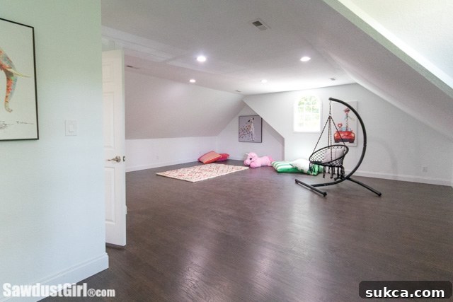bright and organized loft playroom with colorful decor and soft furnishings.
