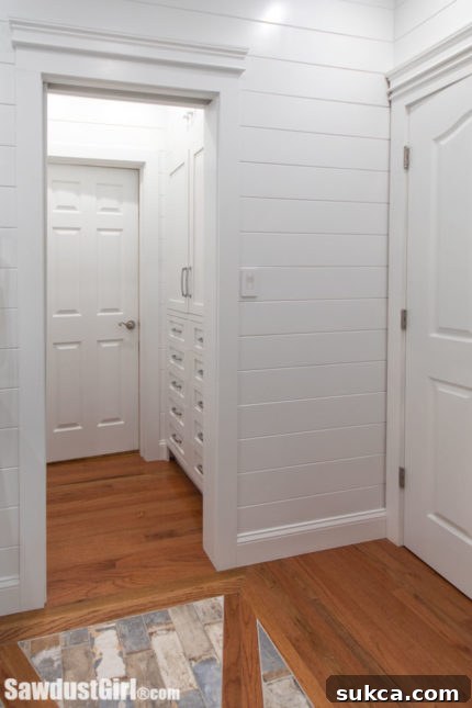 Hallway connecting bedrooms with built-in wardrobes.