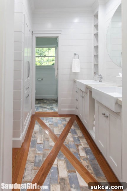 Tile inlaid into the wood floor, leading to the shower and toilet area.