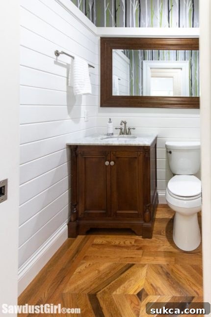 Close-up of the powder room's decorative floor pattern and bespoke vanity.
