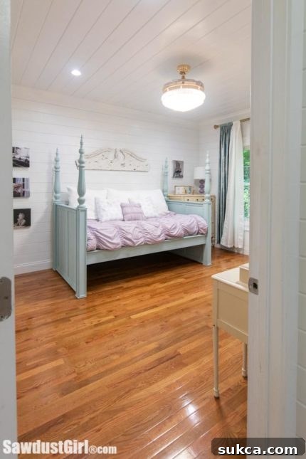 Elegant vintage glam bedroom with upcycled bed and unique decor.