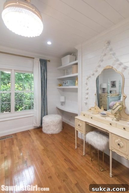 Custom curved floating desk and shelves in a bedroom alcove.