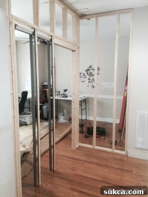 Office wall and pocket door installation, before renovation
