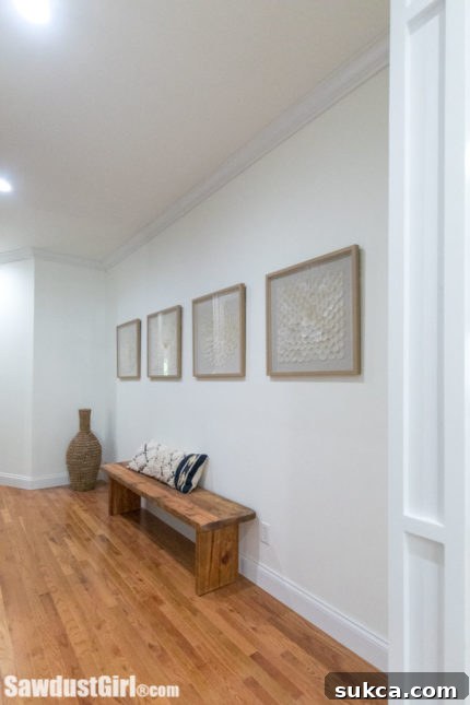 Hallway with a comfortable bench and elegant wall art