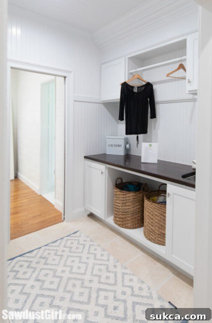Custom laundry room countertop with sink insert for extended workspace