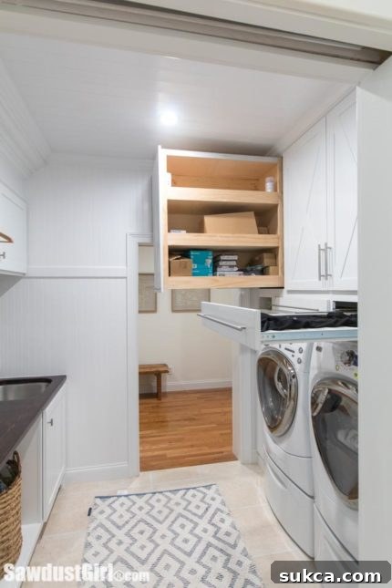 Pull-out drying racks integrated into laundry room cabinets