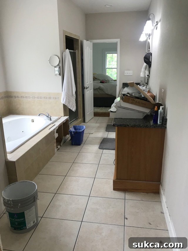 Outdated master bathroom before renovation