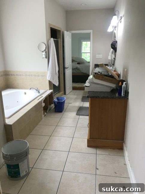 Outdated large bathtub in master bathroom