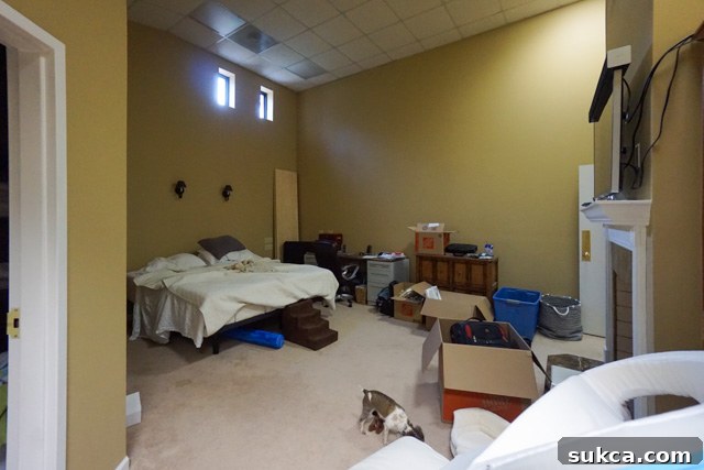 Master Bedroom: A peculiar welcome Master bedroom with two small windows and an unusual layout