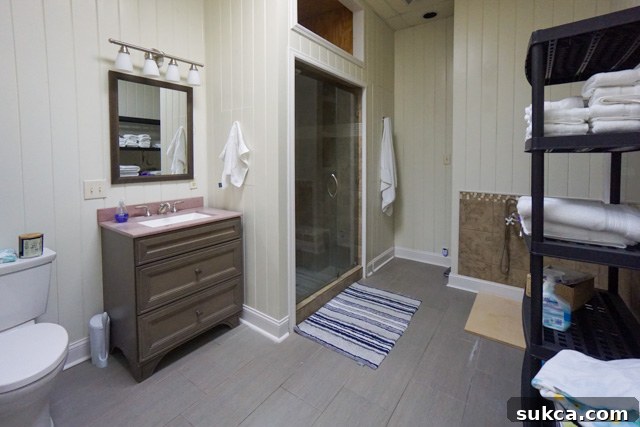 Master Bathroom: Practical storage solutions Master bathroom with built-in storage and a soaking tub