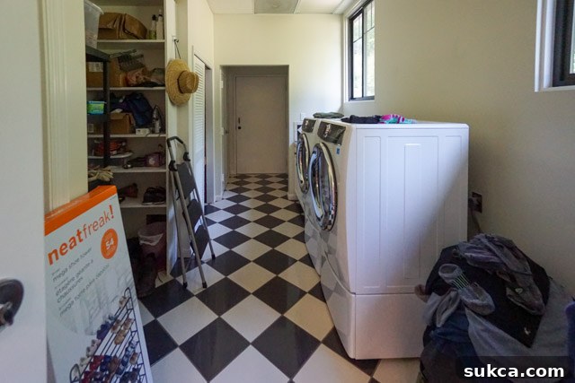 Laundry Room: Functional core, quirky guest bath Laundry room showing mechanical closets and an exit door