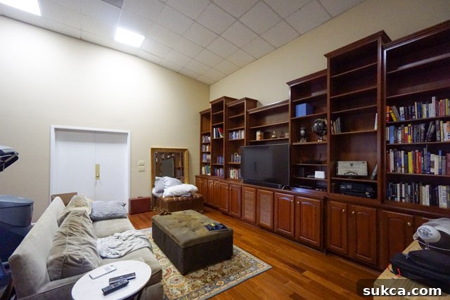 Bookcases with mismatched heights Varying height bookcases in the living room