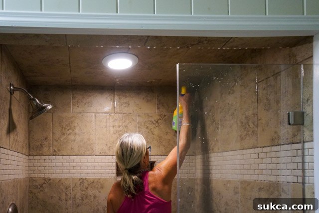 Cleaning grout lines Applying Zep mold and mildew remover to grout