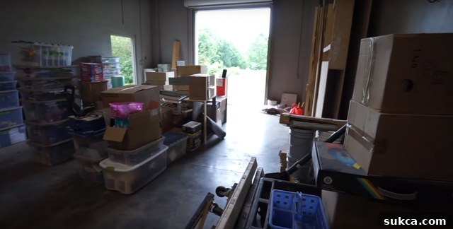 Stacked and labeled storage bins in the new workshop bay