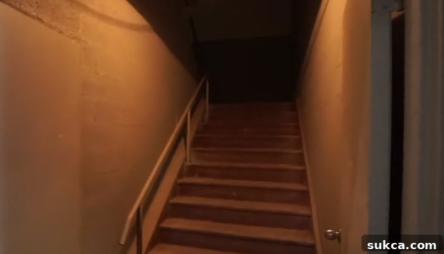 Dark and uninviting stairwell leading to the loft area