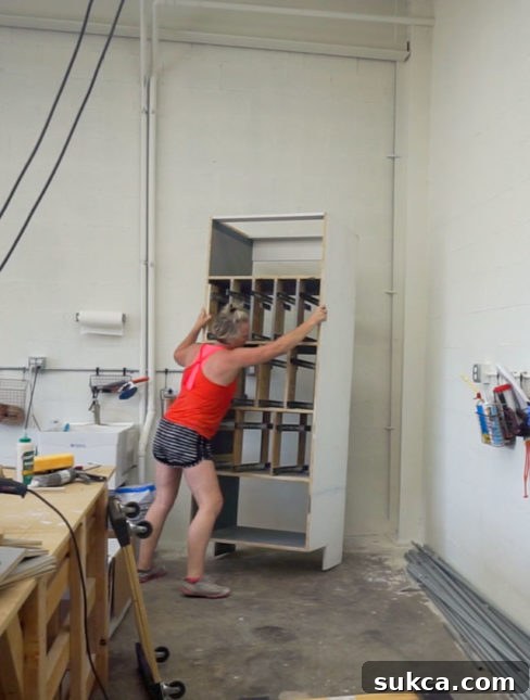 Cabinet installation in workshop Workshop cabinets being installed