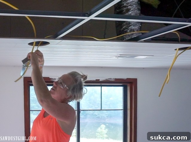 New integrated LED canless lights installed in the WoodHaven plank ceiling, providing modern and flexible illumination.