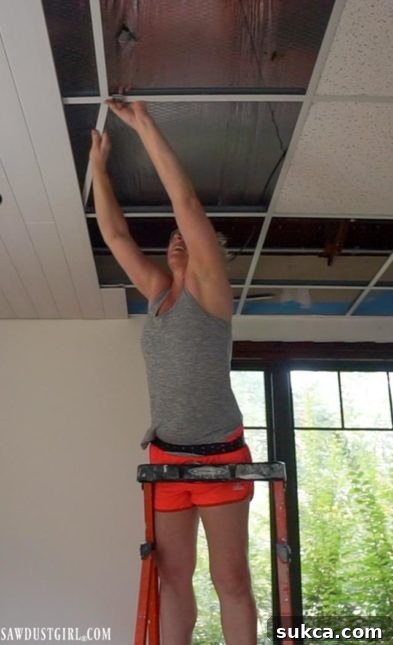 Illustrates proper clip spacing for WoodHaven planks on a suspended ceiling grid, showing clips on perpendicular grid lines.