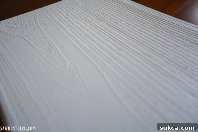 The elegant WoodHaven Classic White ceiling planks, showcasing their real wood grain texture and bright finish.