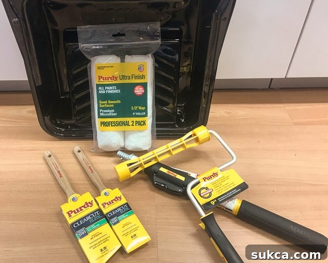 Purdy Painting Tools Collection A selection of high-quality Purdy paint brushes, roller covers, and various painting accessories, perfectly arranged and ready for use in the kitchen refresh.