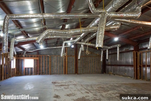 Interior shot of the raw, unfinished upstairs space, highlighting its vast potential for guest suites.