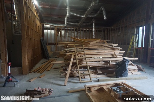 Workshop Interior Demolition An interior view of the workshop during demolition, showcasing the exposed structure and debris.