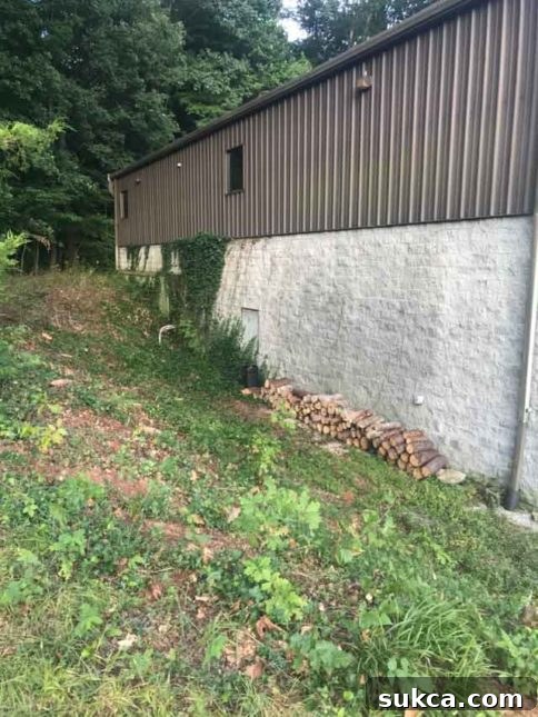 Protected Foundation Wall Exterior Recently waterproofed foundation wall, now looking clean and protected.