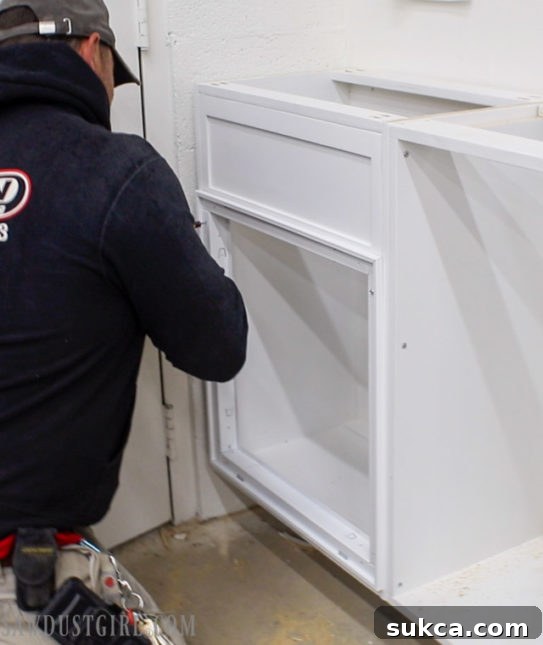 Attaching the false front to the cabinet for the air return