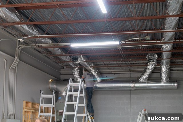 Flexible ductwork installed in the workshop ceiling