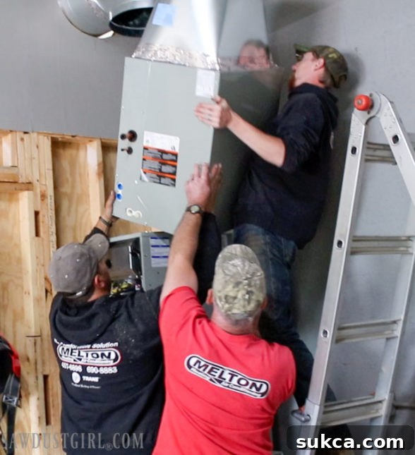 Close-up of the Trane XC95m furnace installed in the workshop