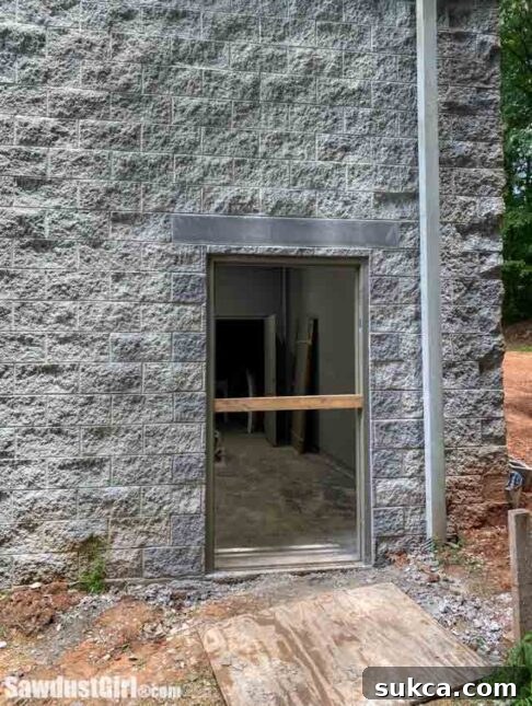 Newly installed door in the concrete block wall.