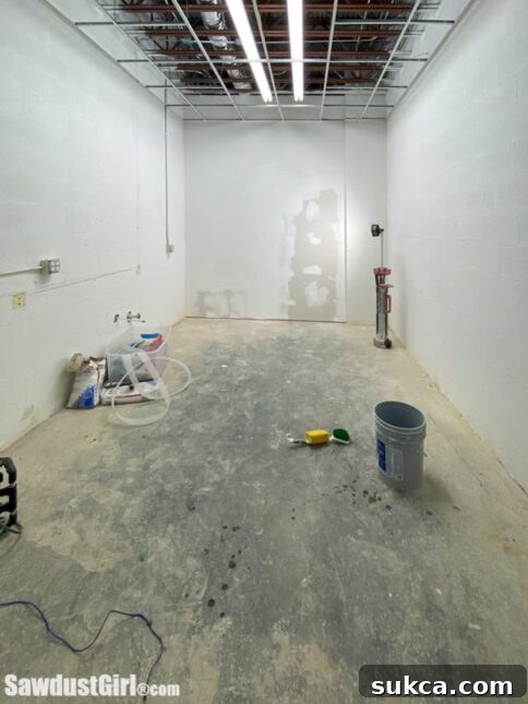 Interior view of the break room with framed walls.