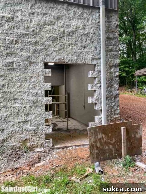 Cutting out concrete block for the new door opening.