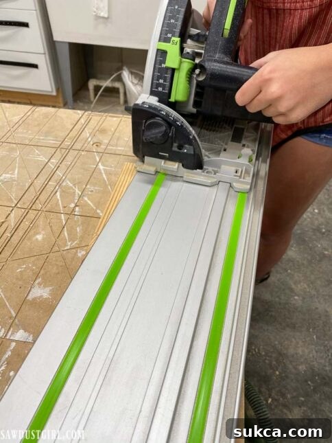 Cutting the top angle of the ladder leg with a saw