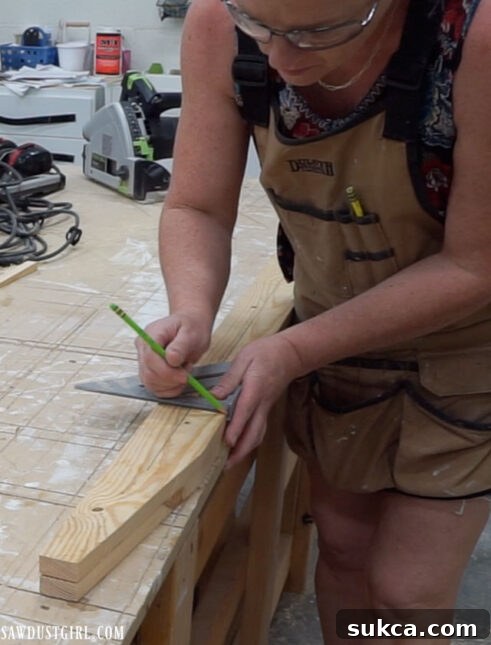 Measuring and marking the holes for dowels on the ladder leg