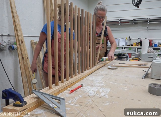 Applying glue to dowel ends before inserting into ladder legs