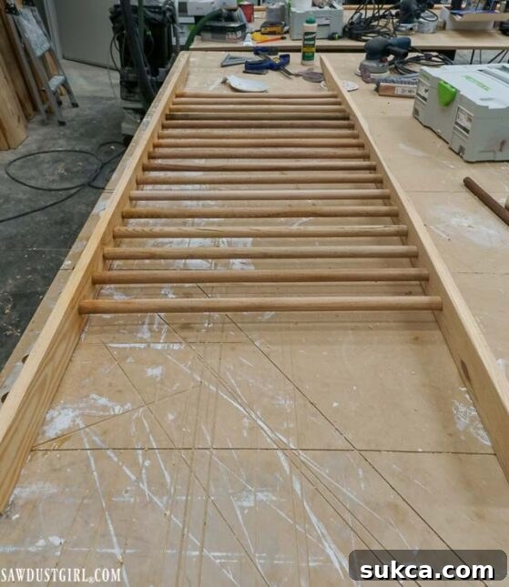 Detailed view of final sanding on the assembled shoe ladder