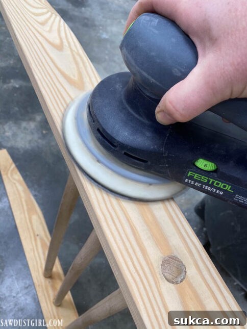 Inspecting the boot ladder for smoothness before applying finish