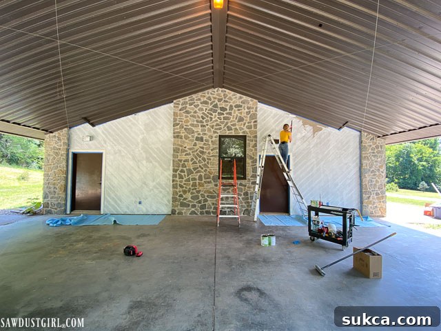 Before shot of the carport entryway, showing dull colors and old fixtures