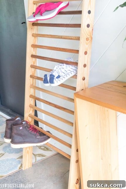 Close-up of different boots stored efficiently on the ladder rungs