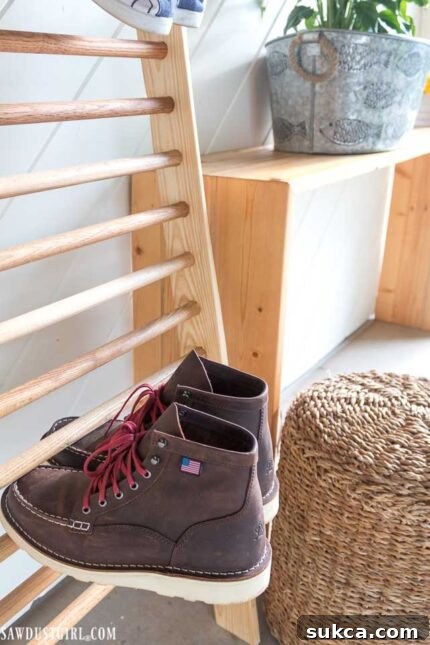 Entry table placed beside the shoe ladder, offering a handy spot for daily essentials