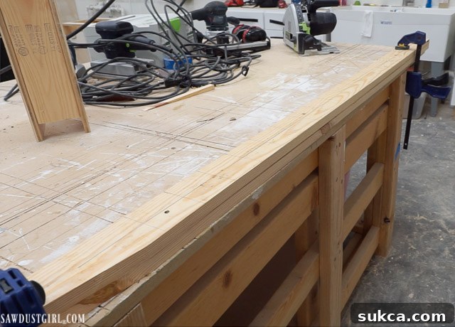 Securing two ladder legs together with woodworking tape for accurate cuts