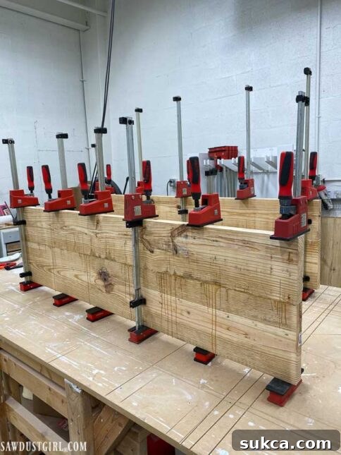 Craft Your Own Bench with Integrated Boot Storage 12 Clamping together glued bench pieces