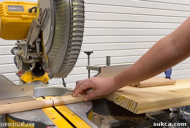 Craft Your Own Bench with Integrated Boot Storage 19 Using a stop block on a miter saw for consistent dowel cuts
