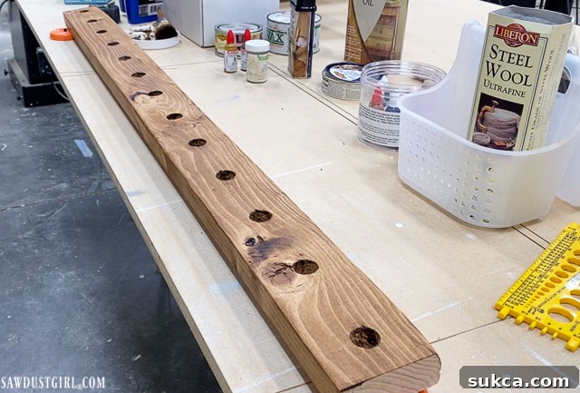 Craft Your Own Bench with Integrated Boot Storage 20 Boot rack 2x4 with drilled holes before dowel insertion