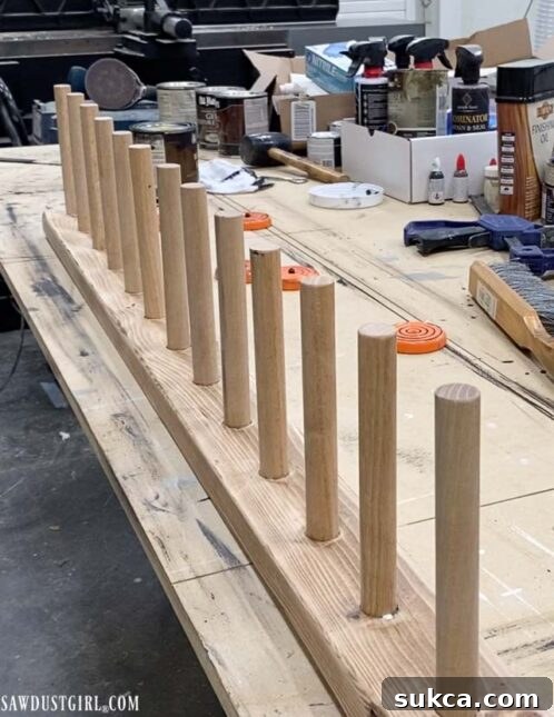 Craft Your Own Bench with Integrated Boot Storage 21 Boot rack with dowels inserted and ready for staining