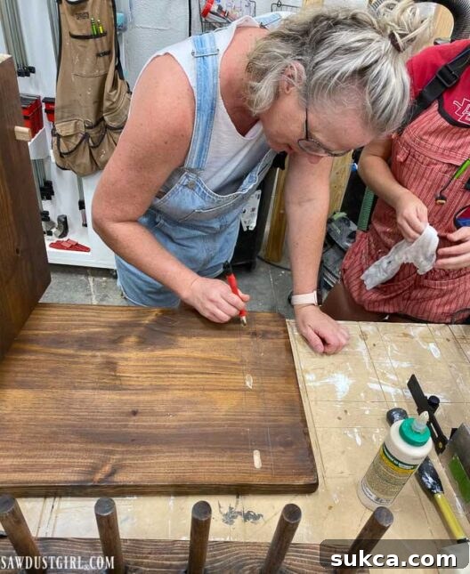 Craft Your Own Bench with Integrated Boot Storage 26 Applying glue to mortises during bench assembly
