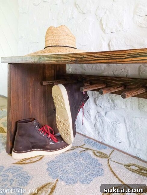 Craft Your Own Bench with Integrated Boot Storage 30 Detail of boots stored on the custom boot rack bench