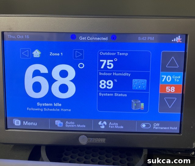 Trane ComfortLink Thermostat A modern Trane ComfortLink thermostat displaying temperature settings, emphasizing smart home technology and precise climate control.