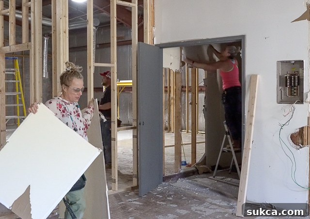 New entrance framing at the top of the stairs, showing revised doorway placements